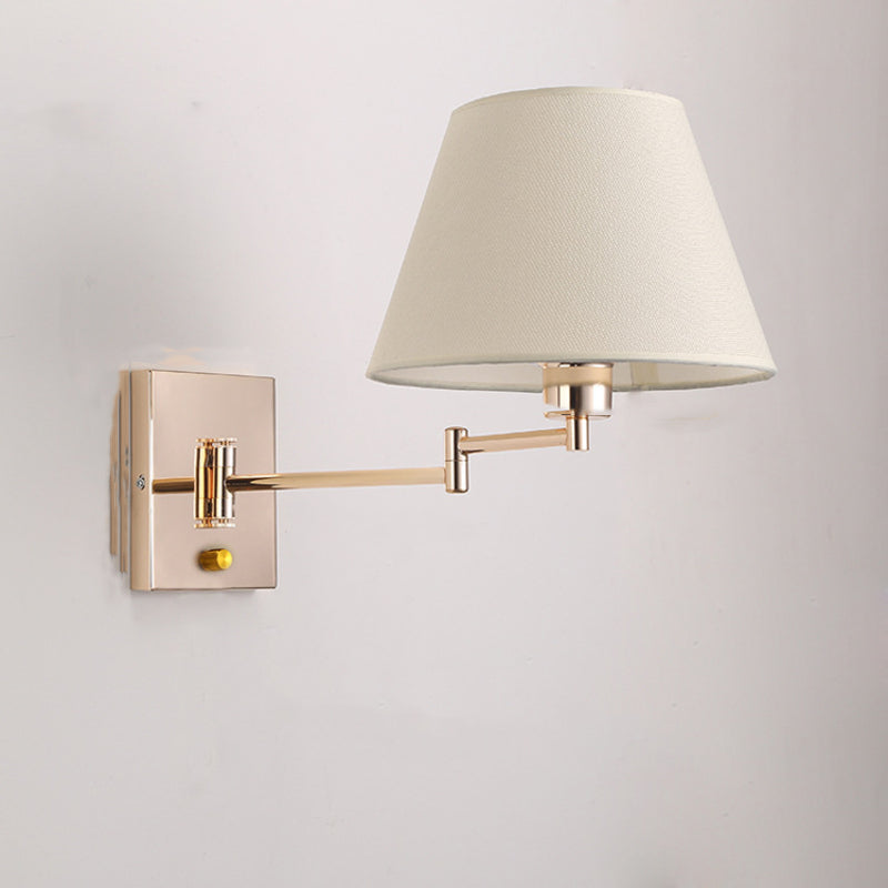 Brady fabric wall lamp with adjustable gold arm.