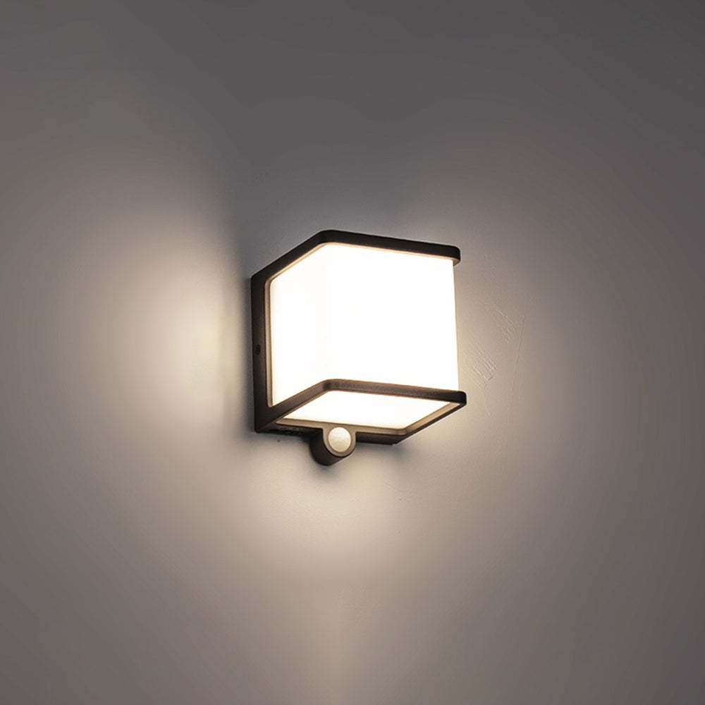 Orr solar wall lamp: minimalist outdoor light on gray wall.