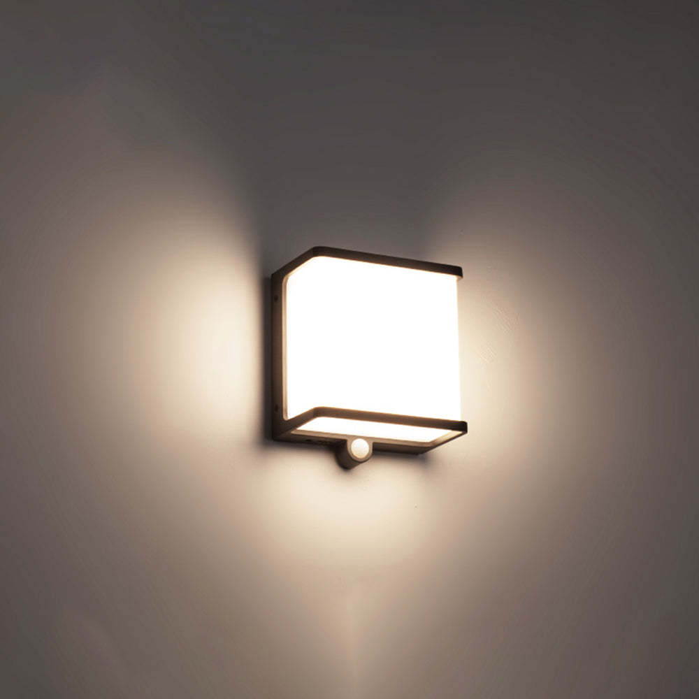 Orr solar wall lamp: modern outdoor lighting on gray wall.