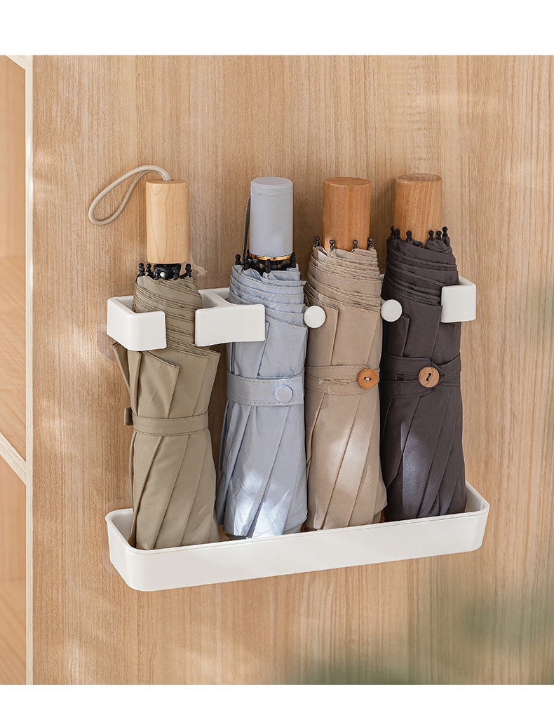 Space-saving umbrella holder on wall