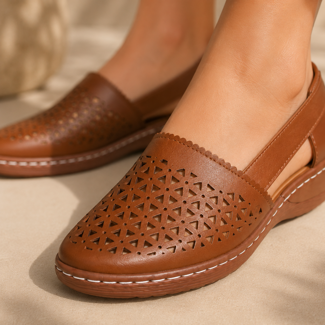 Close-up of brown geometric cutout shoe upper