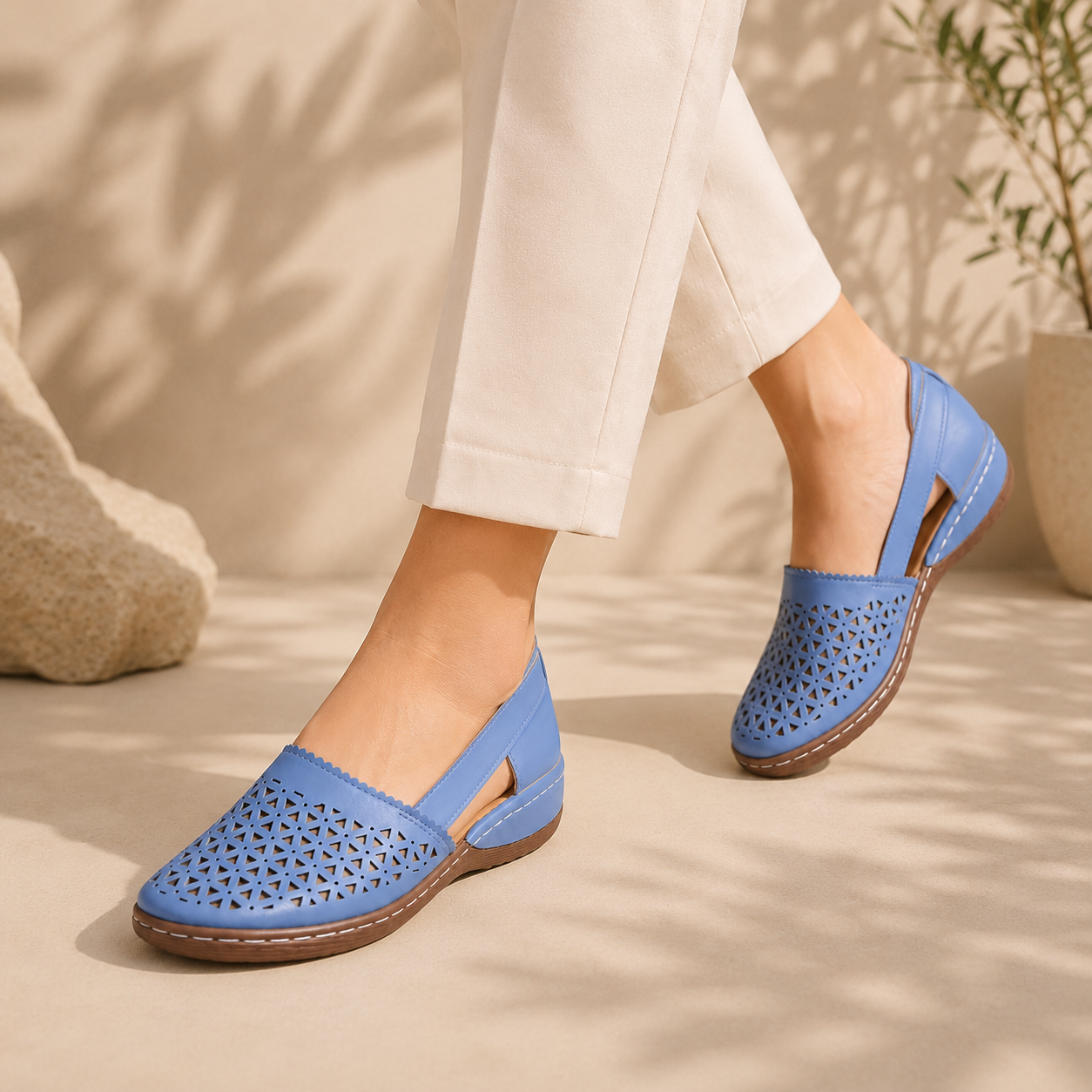Woman walking in blue breathable cutout comfort shoes