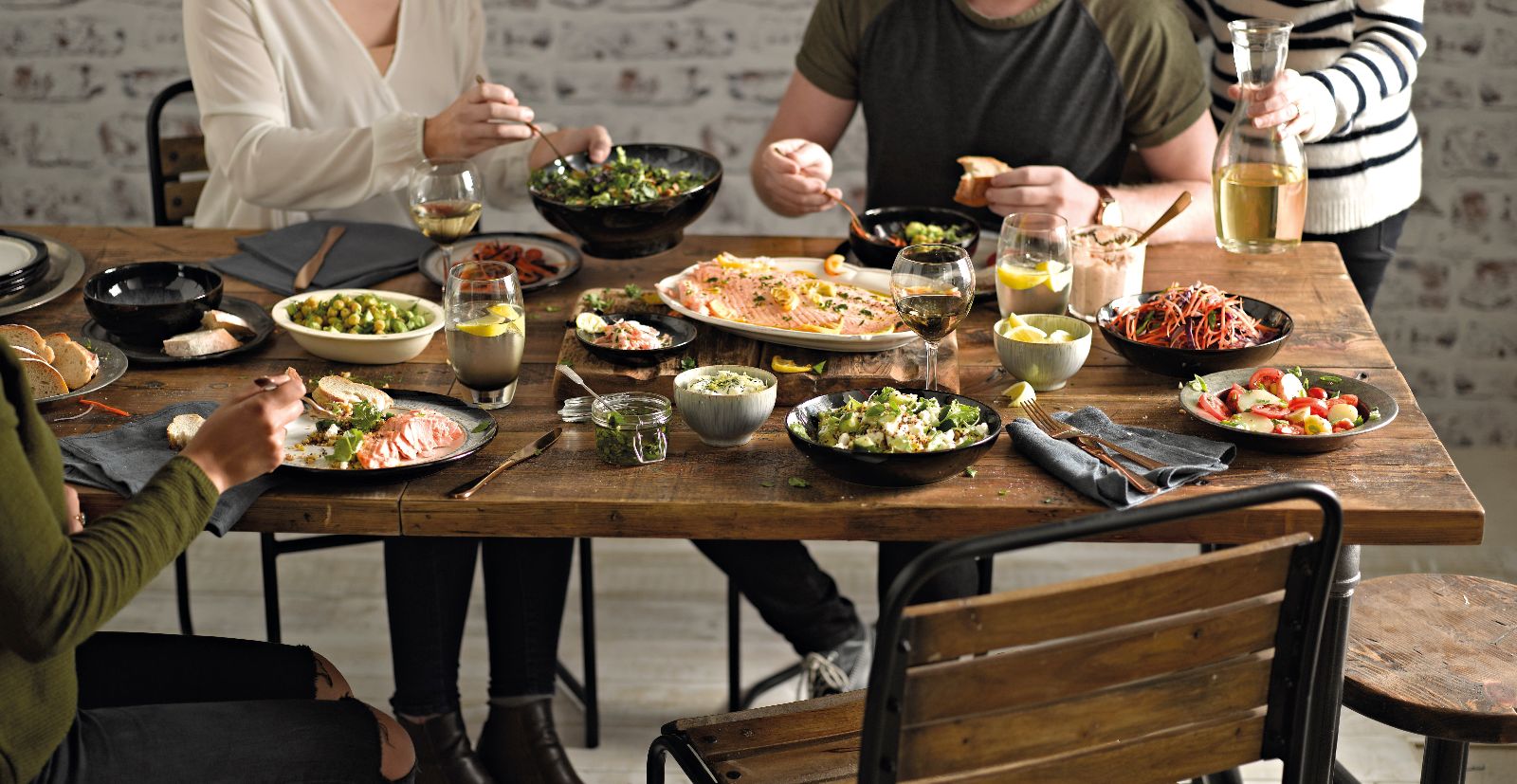 Four people eating tapas
