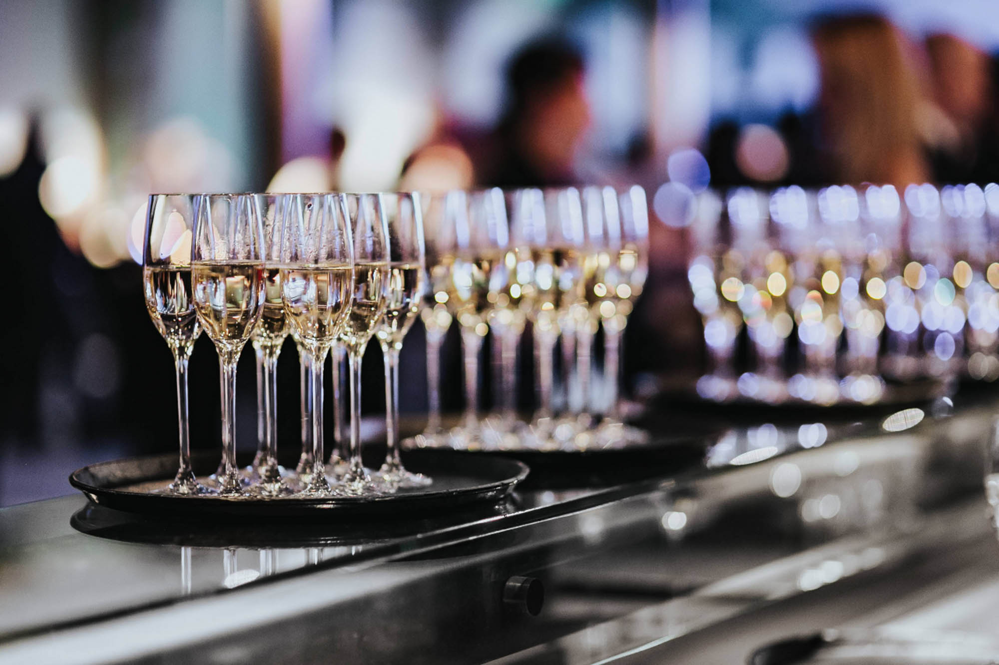 Champagne glasses on a serving tray Champagne glasses on a serving tray