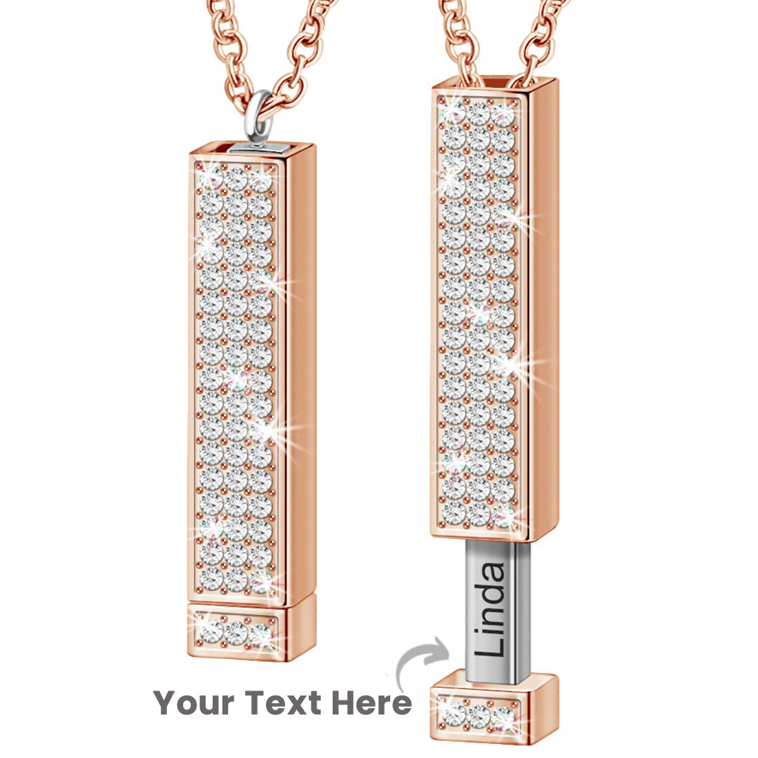 Zircon tube pendant with hidden engraved text