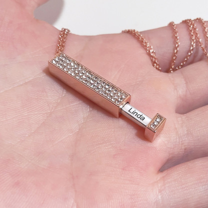 Zircon tube pendant with hidden engraved text