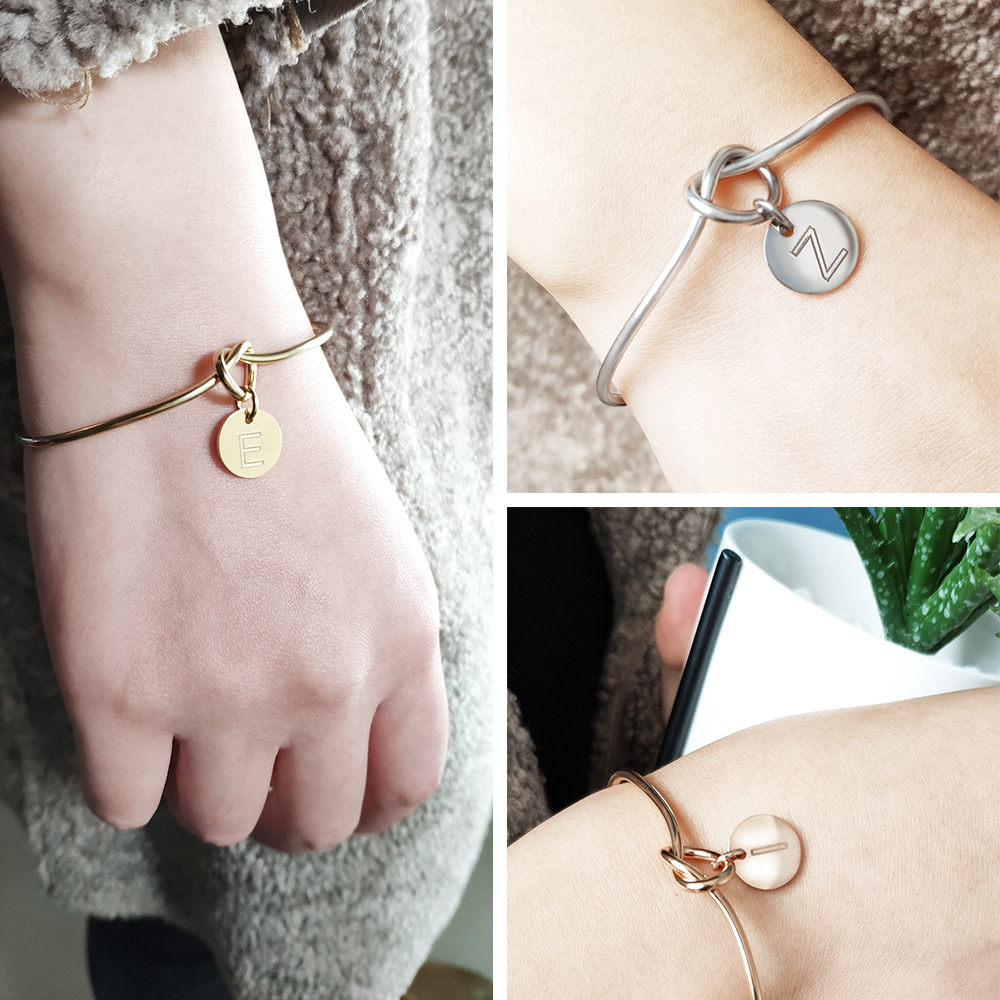 Alphabet charm tie bracelet