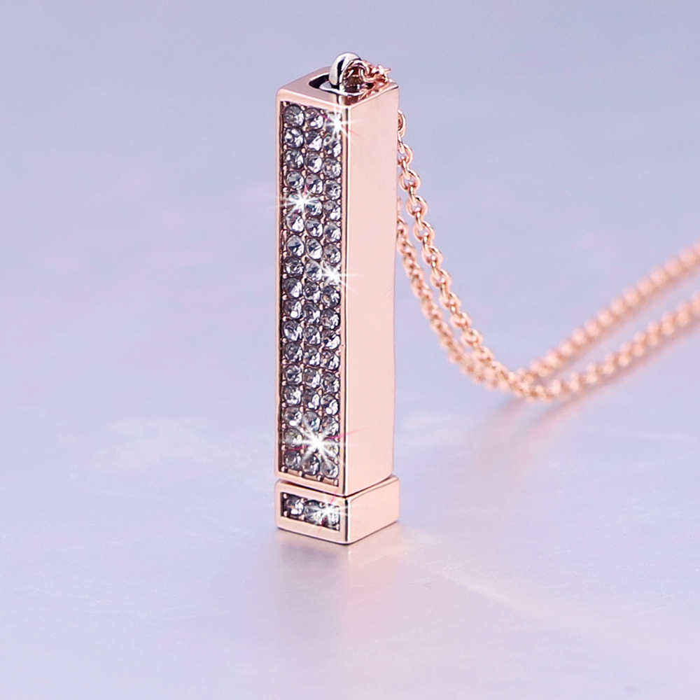 Zircon tube pendant with hidden engraved text