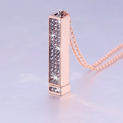 Zircon tube pendant with hidden engraved text