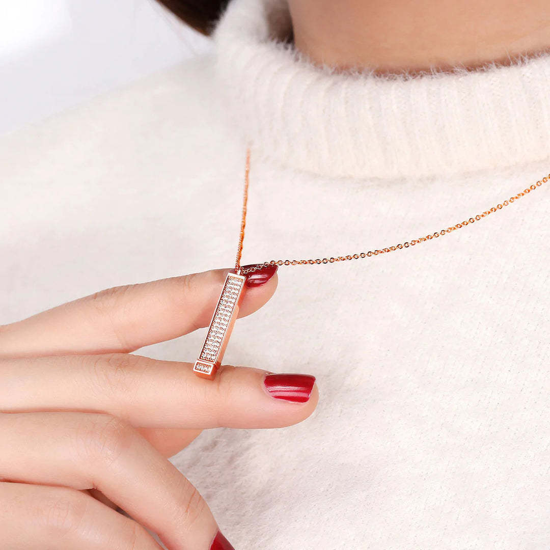 Zircon tube pendant with hidden engraved text