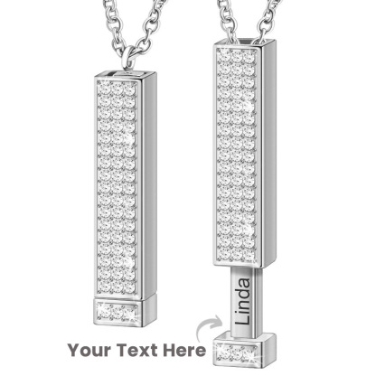 Zircon tube pendant with hidden engraved text