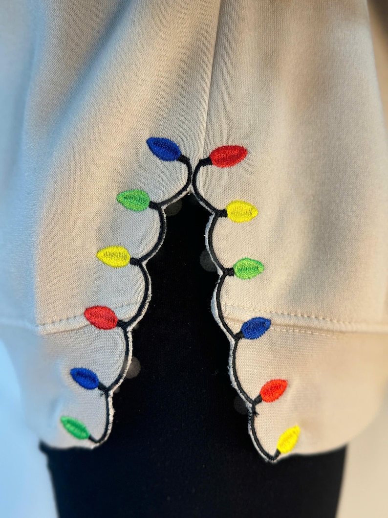 We Can Leave The Christmas Lights Up 'Til January sweatshirt , Embroidered Christmas Lights Cut Hem sweatshirt, Side Bow Appliqué Sweatshirt