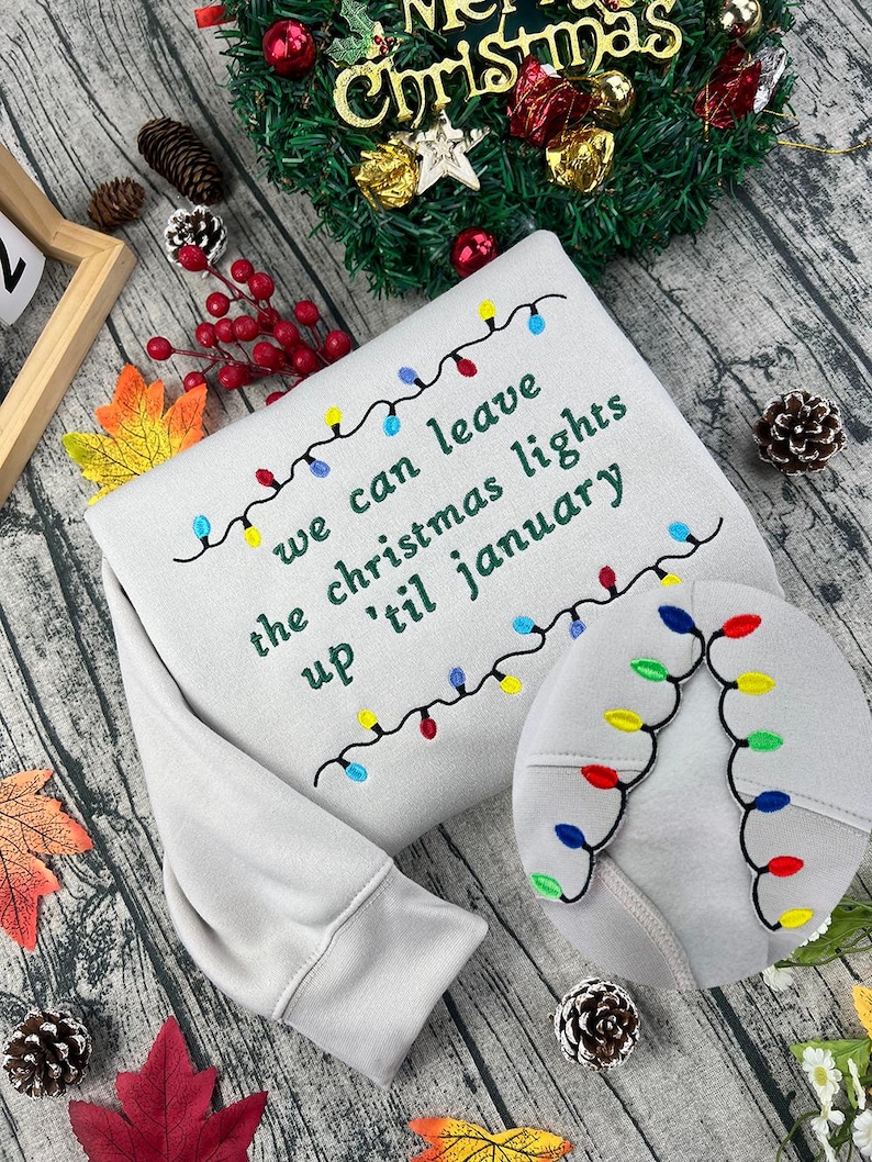We Can Leave The Christmas Lights Up 'Til January sweatshirt , Embroidered Christmas Lights Cut Hem sweatshirt, Side Bow Appliqué Sweatshirt
