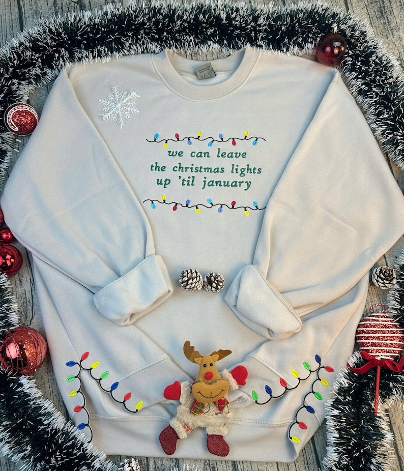 We Can Leave The Christmas Lights Up 'Til January sweatshirt , Embroidered Christmas Lights Cut Hem sweatshirt, Side Bow Appliqué Sweatshirt