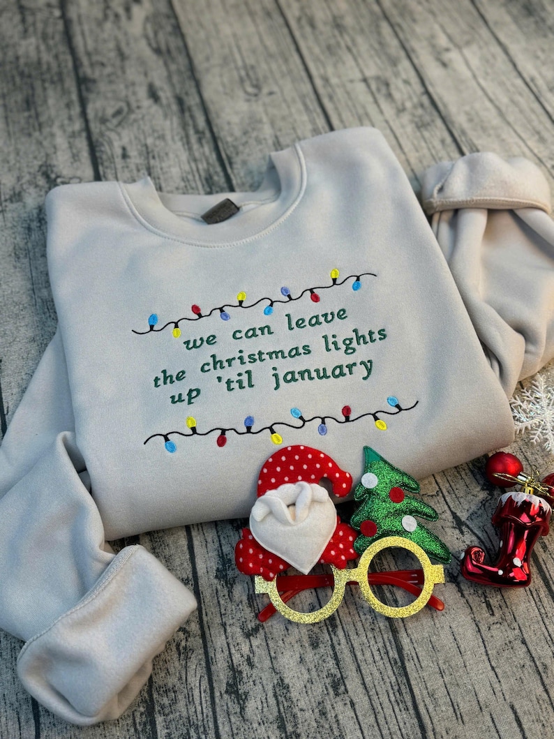 We Can Leave The Christmas Lights Up 'Til January sweatshirt , Embroidered Christmas Lights Cut Hem sweatshirt, Side Bow Appliqué Sweatshirt
