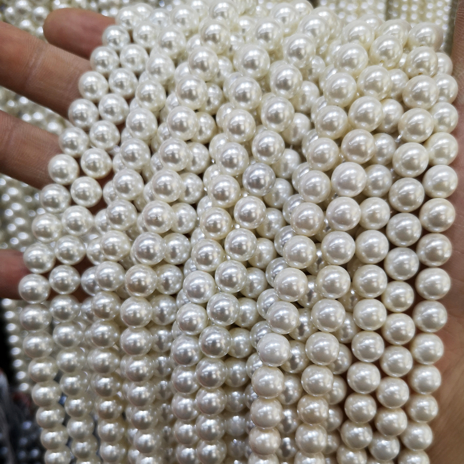 Pearls with holes punched for DIY use