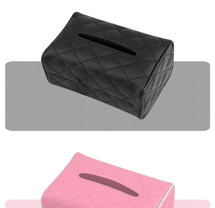 Car interior with hanging tissue holder on sun visor