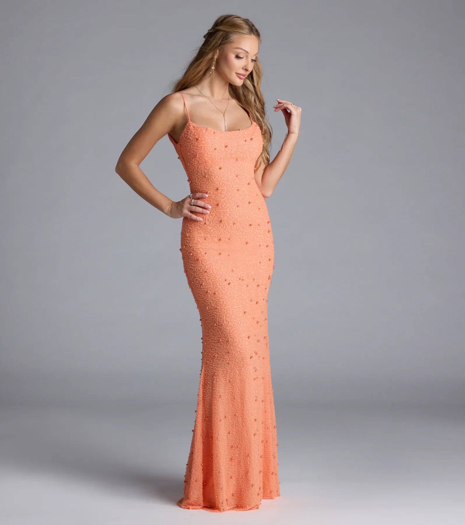 Turn heads at Prom 2025 in this orange prom dress, where statement-making details meet the iconic style of the Amara Corset Mermaid Sequin Formal Dress.