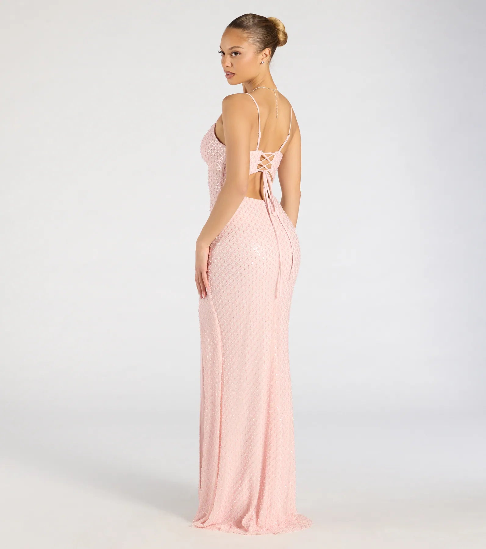 Turn heads at Prom 2025 in this pink prom dress, where statement-making details meet the iconic style of the Valeria Cutout Lace-Up Sequin Beaded Formal Dress.