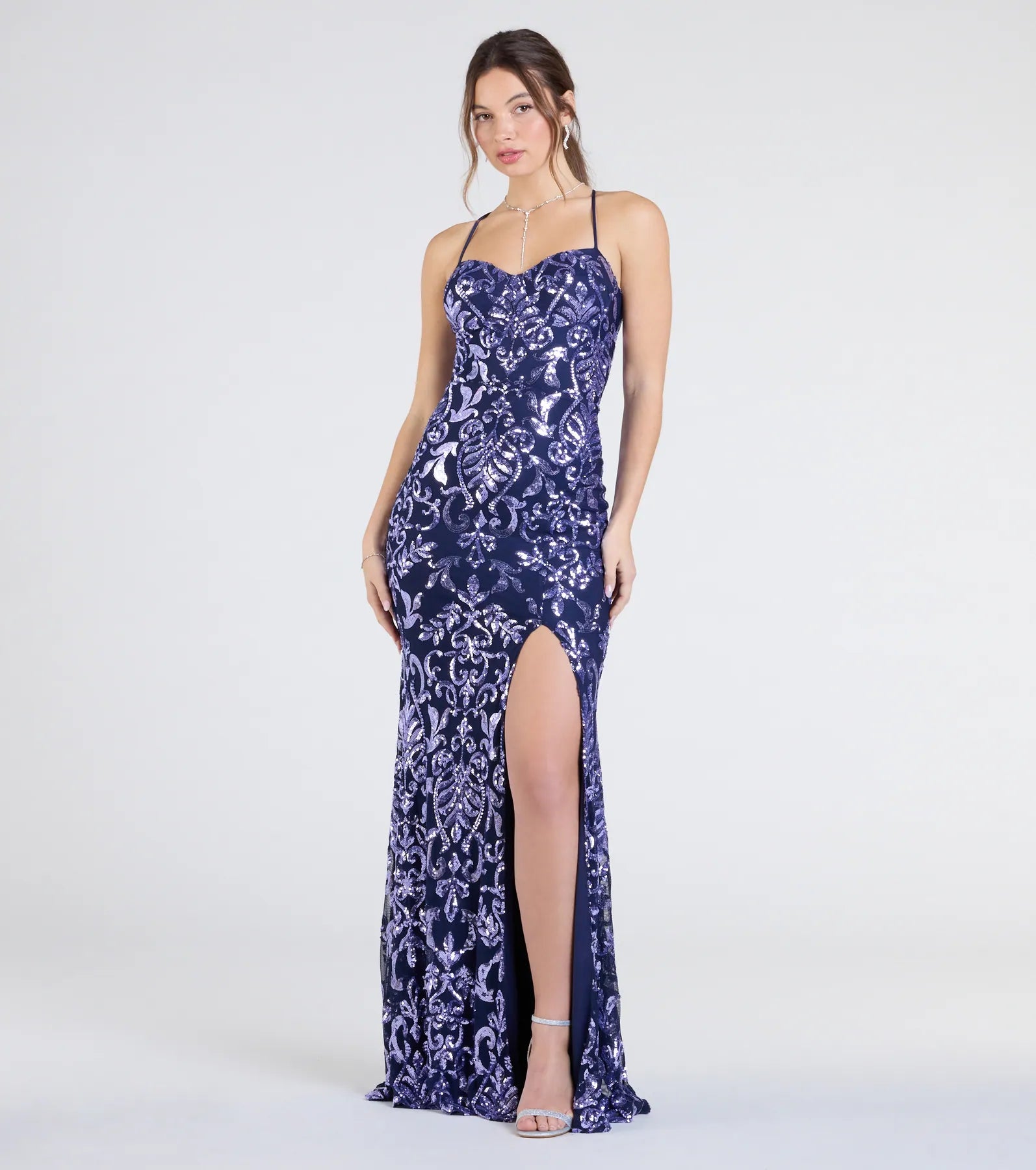 Step into the Prom 2025 dance in the Shelby Lace-Up Slit Sequin Formal Dress in navy, a stunning blue prom dress designed to complement any theme with its timeless allure and statement-making style.