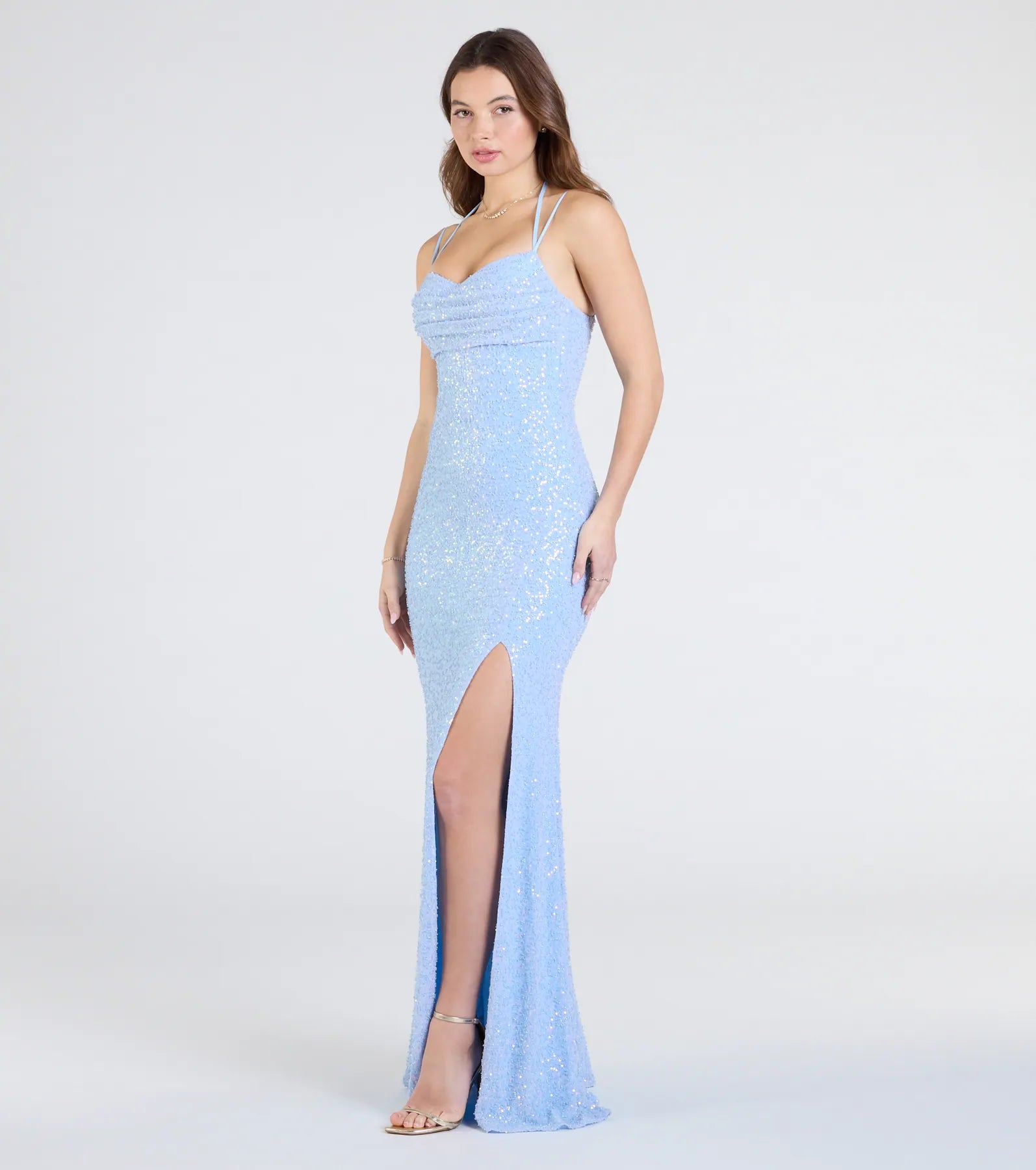 Step into the Prom 2025 dance in the Kaitlyn Cowl Neck Slit Beaded Sequin Formal Dress in light blue, a stunning blue prom dress designed to complement any theme with its timeless allure and statement-making style.
