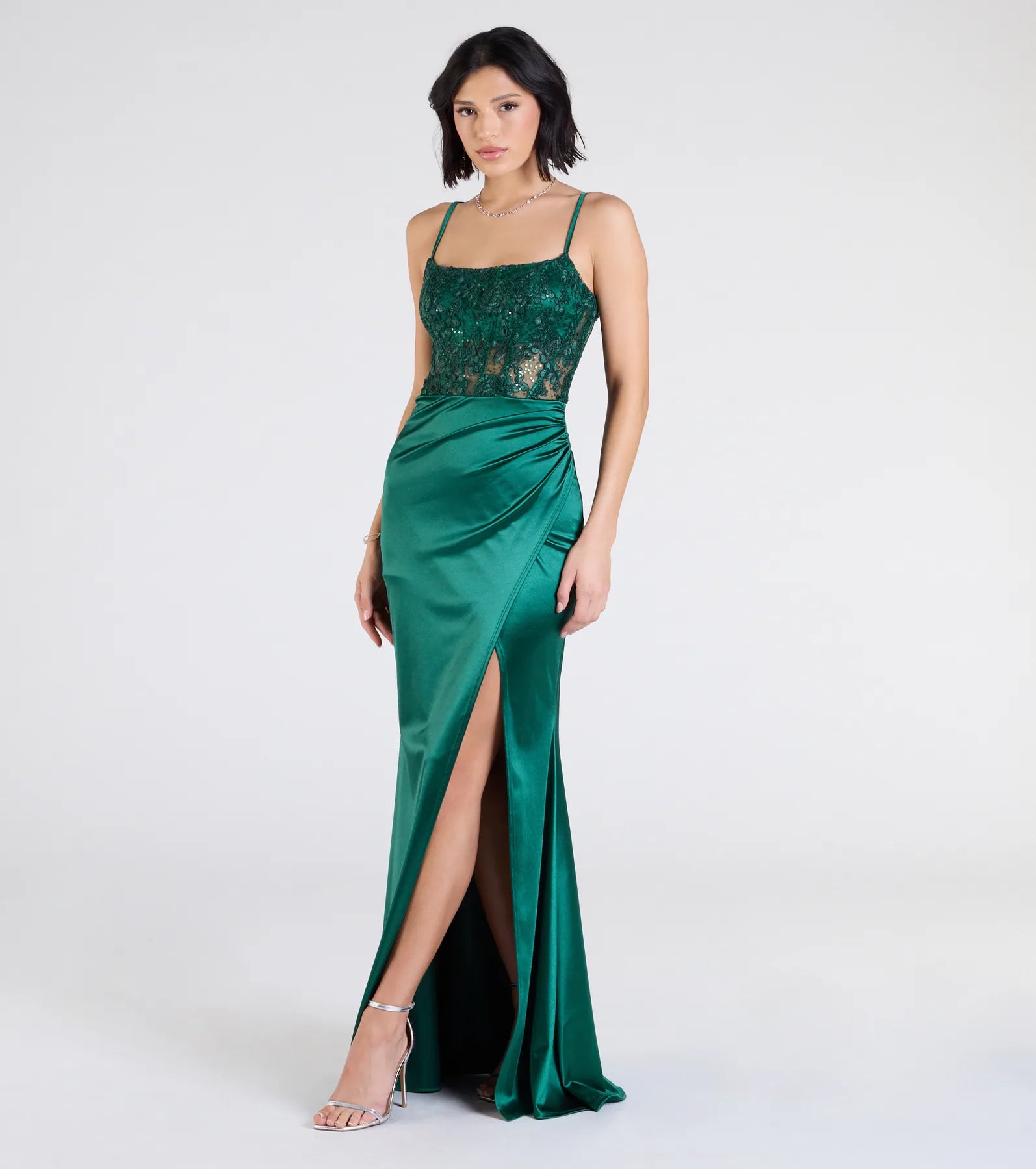 Turn heads at Prom 2025 in this hunter green prom dress, where statement-making details meet the iconic style of the Lucia Lace Corset Slit Satin Formal Dress.