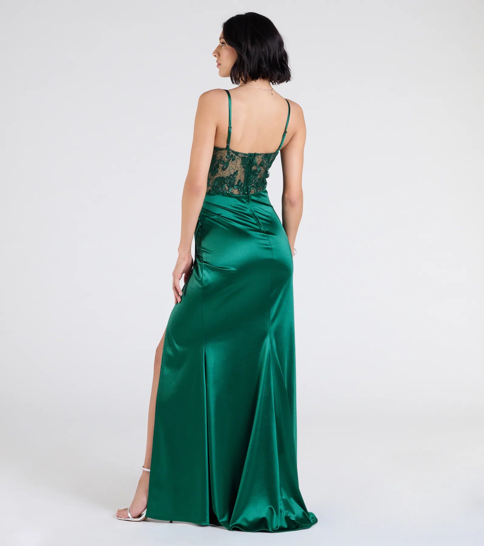 Turn heads at Prom 2025 in this hunter green prom dress, where statement-making details meet the iconic style of the Lucia Lace Corset Slit Satin Formal Dress.