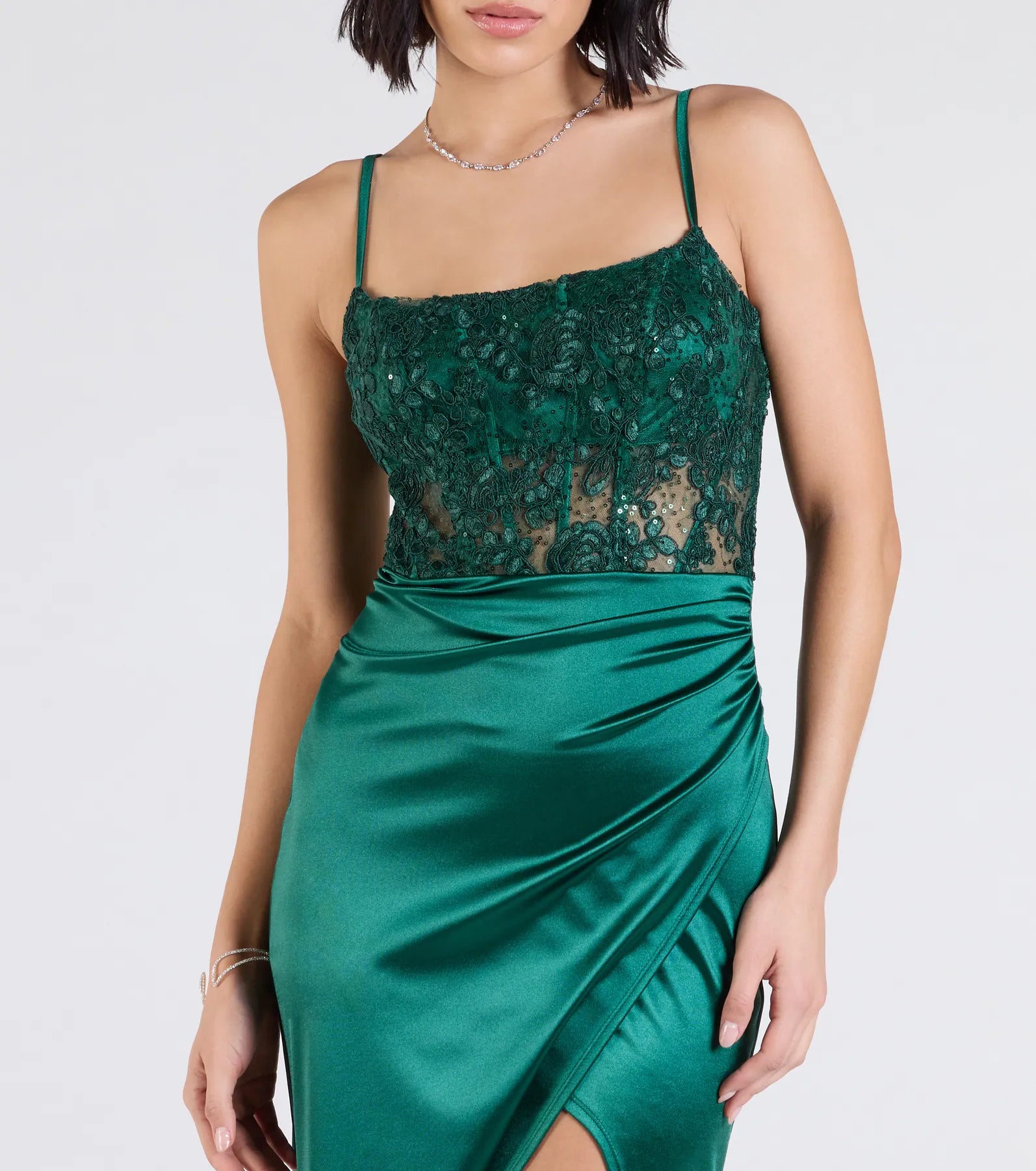 Turn heads at Prom 2025 in this hunter green prom dress, where statement-making details meet the iconic style of the Lucia Lace Corset Slit Satin Formal Dress.