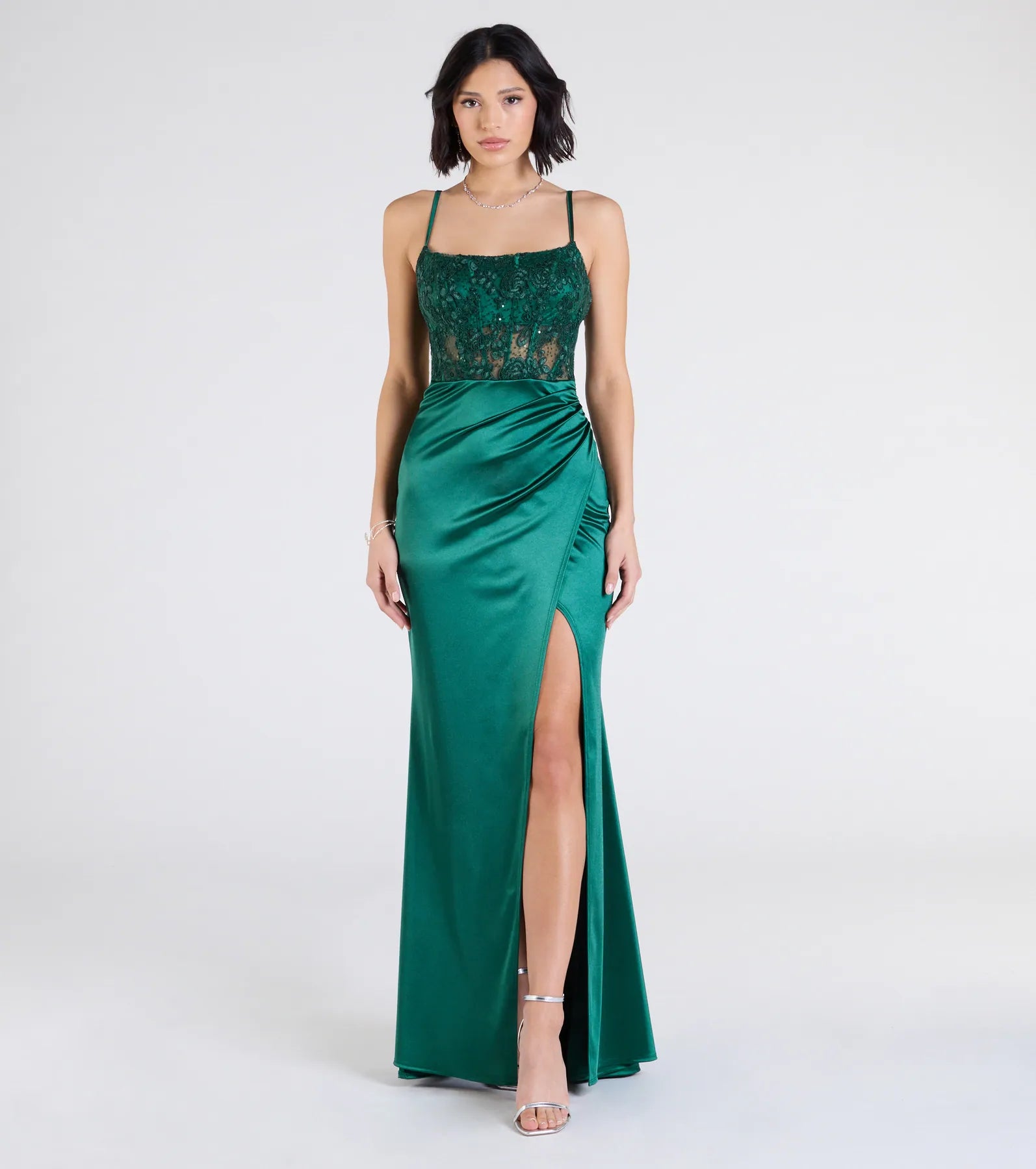Turn heads at Prom 2025 in this hunter green prom dress, where statement-making details meet the iconic style of the Lucia Lace Corset Slit Satin Formal Dress.