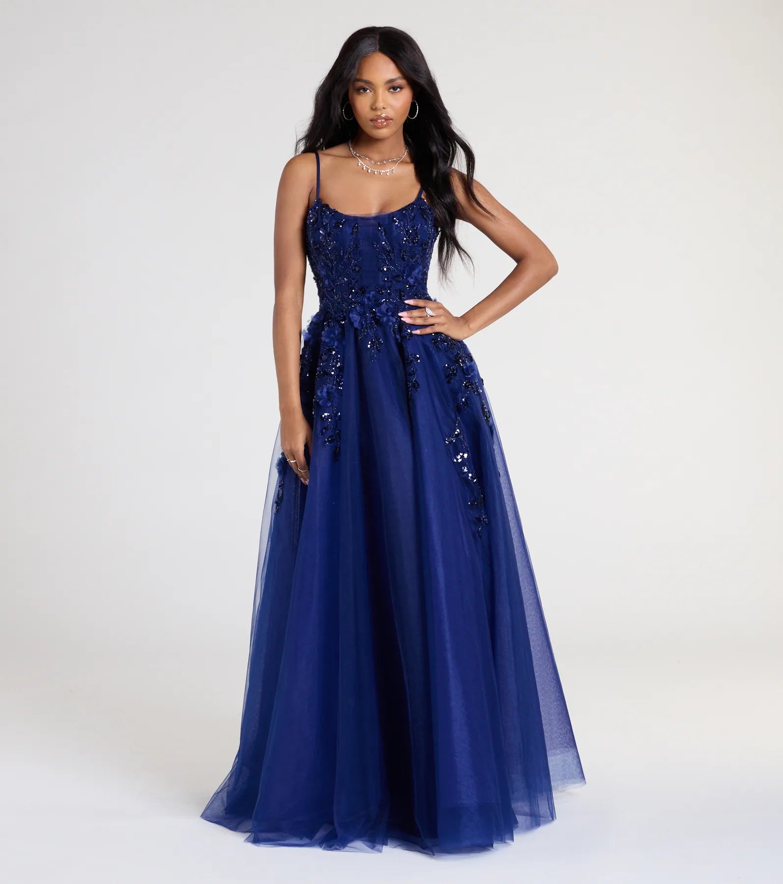Turn heads at Prom 2025 in this navy blue prom dress, where statement-making details meet the iconic style of the Lula A-Line Sequin Floral Tulle Ball Gown.