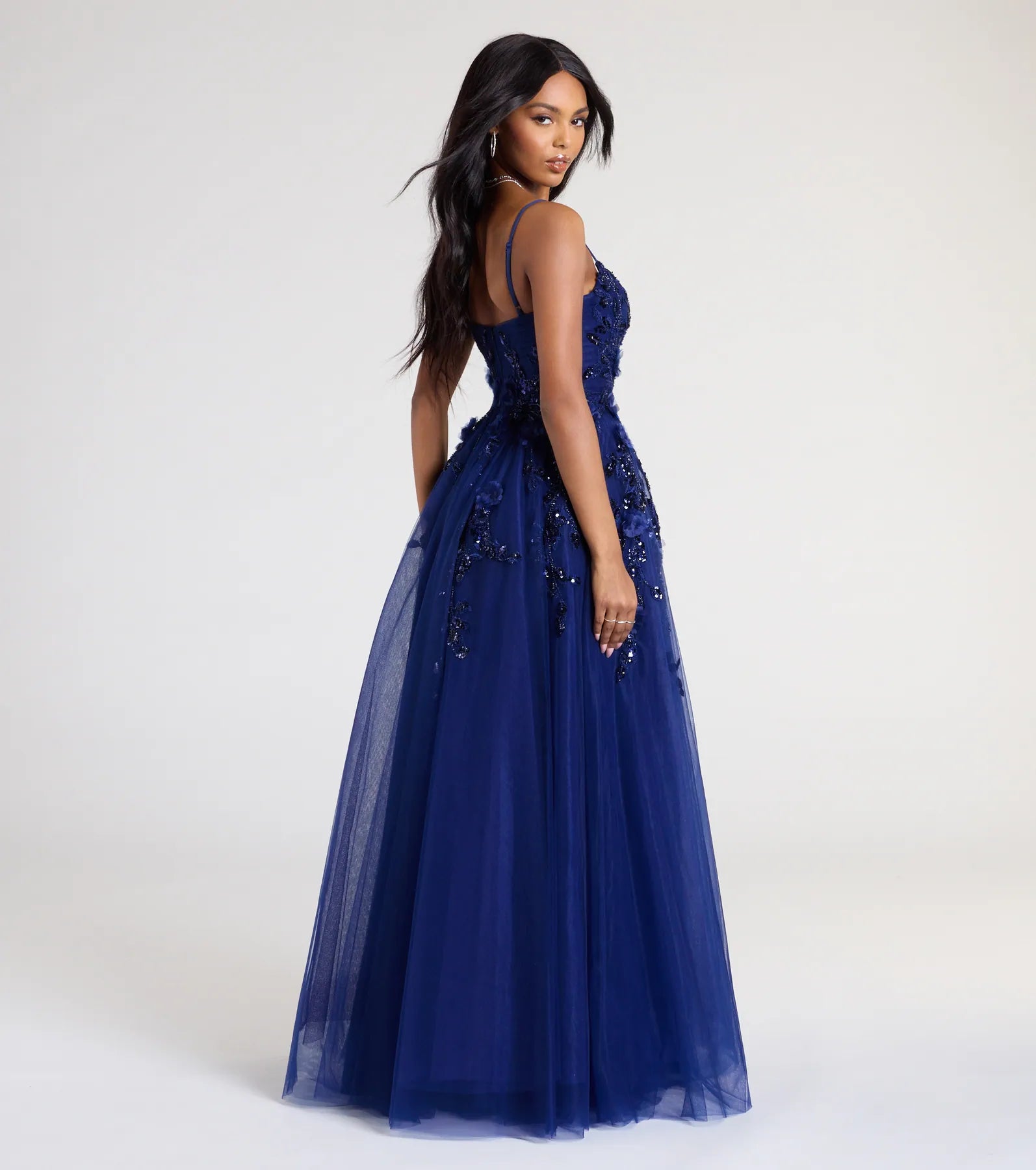 Turn heads at Prom 2025 in this navy blue prom dress, where statement-making details meet the iconic style of the Lula A-Line Sequin Floral Tulle Ball Gown.