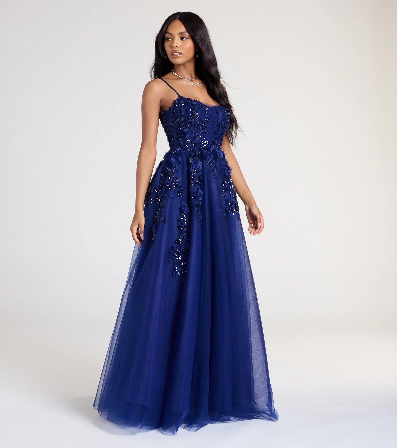 Turn heads at Prom 2025 in this navy blue prom dress, where statement-making details meet the iconic style of the Lula A-Line Sequin Floral Tulle Ball Gown.