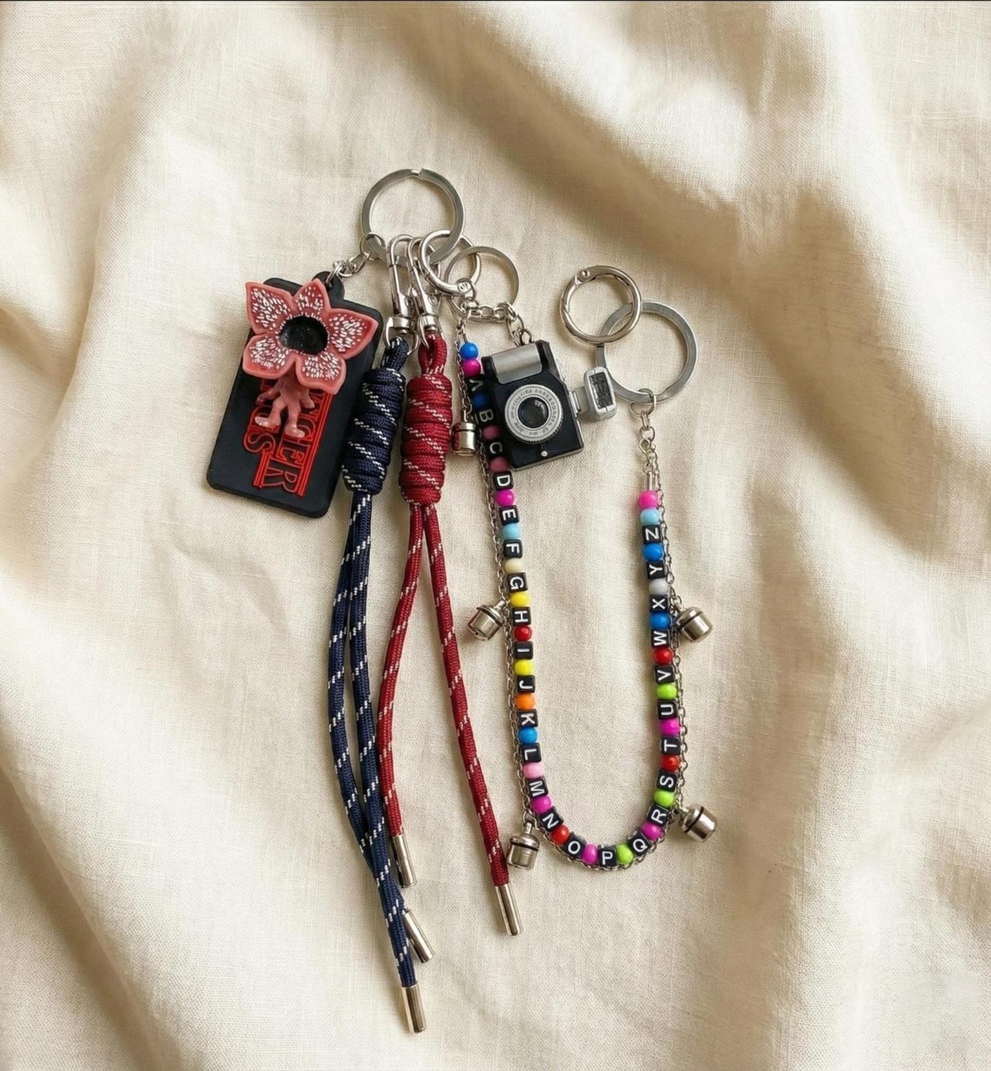 Stranger Things Light-Up Keychain Set with 5 LED Beads | Demogorgon Bag Charm with Replaceable Batteries | Hawkins Inspired Accessories for Backpacks & Keys | Glowing Fan Merch Gift for Netflix Series Lovers