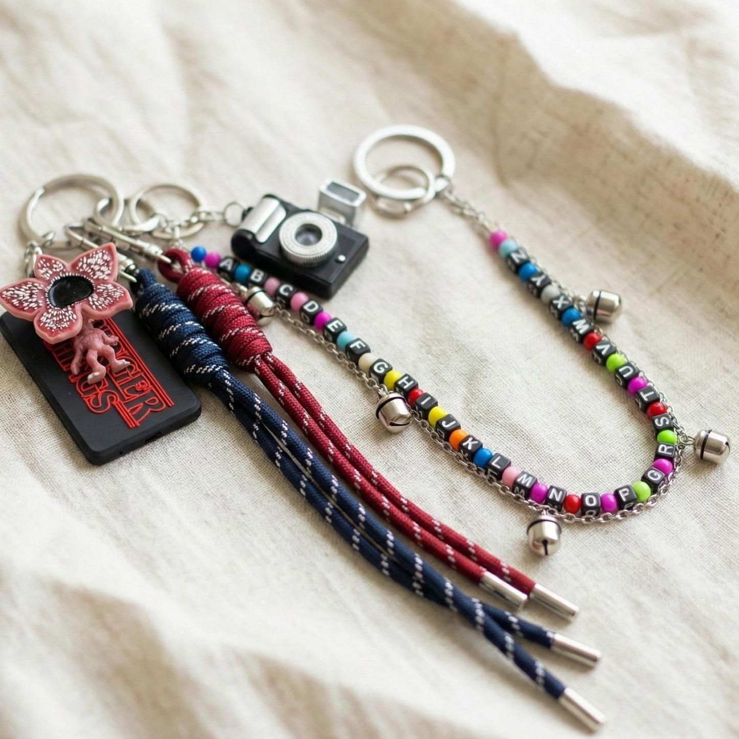 Stranger Things Light-Up Keychain Set with 5 LED Beads | Demogorgon Bag Charm with Replaceable Batteries | Hawkins Inspired Accessories for Backpacks & Keys | Glowing Fan Merch Gift for Netflix Series Lovers