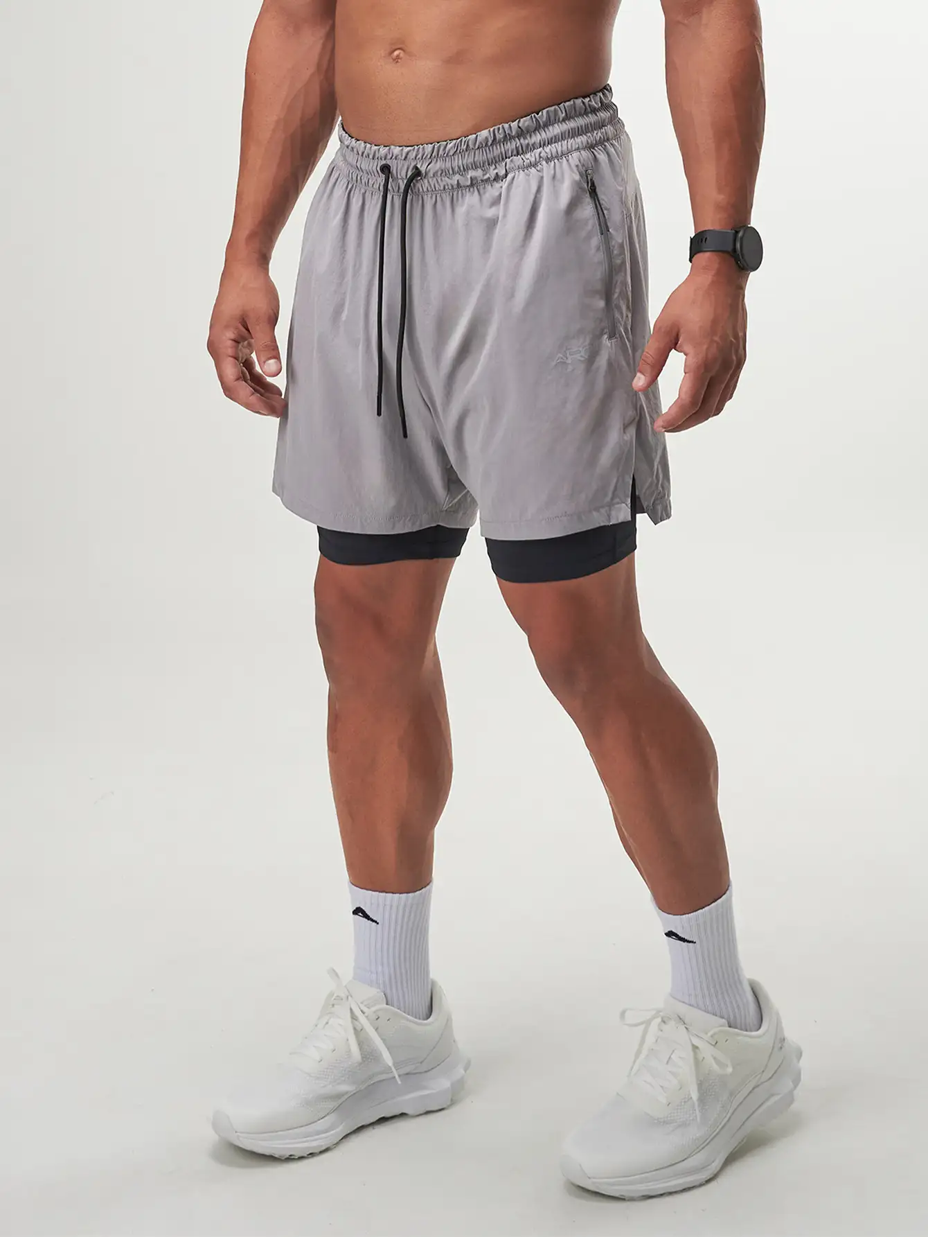 Grey Flow Form 5" 2-in-1 shorts, perfect for workouts and casual wear, featuring built-in liner for comfort and support.