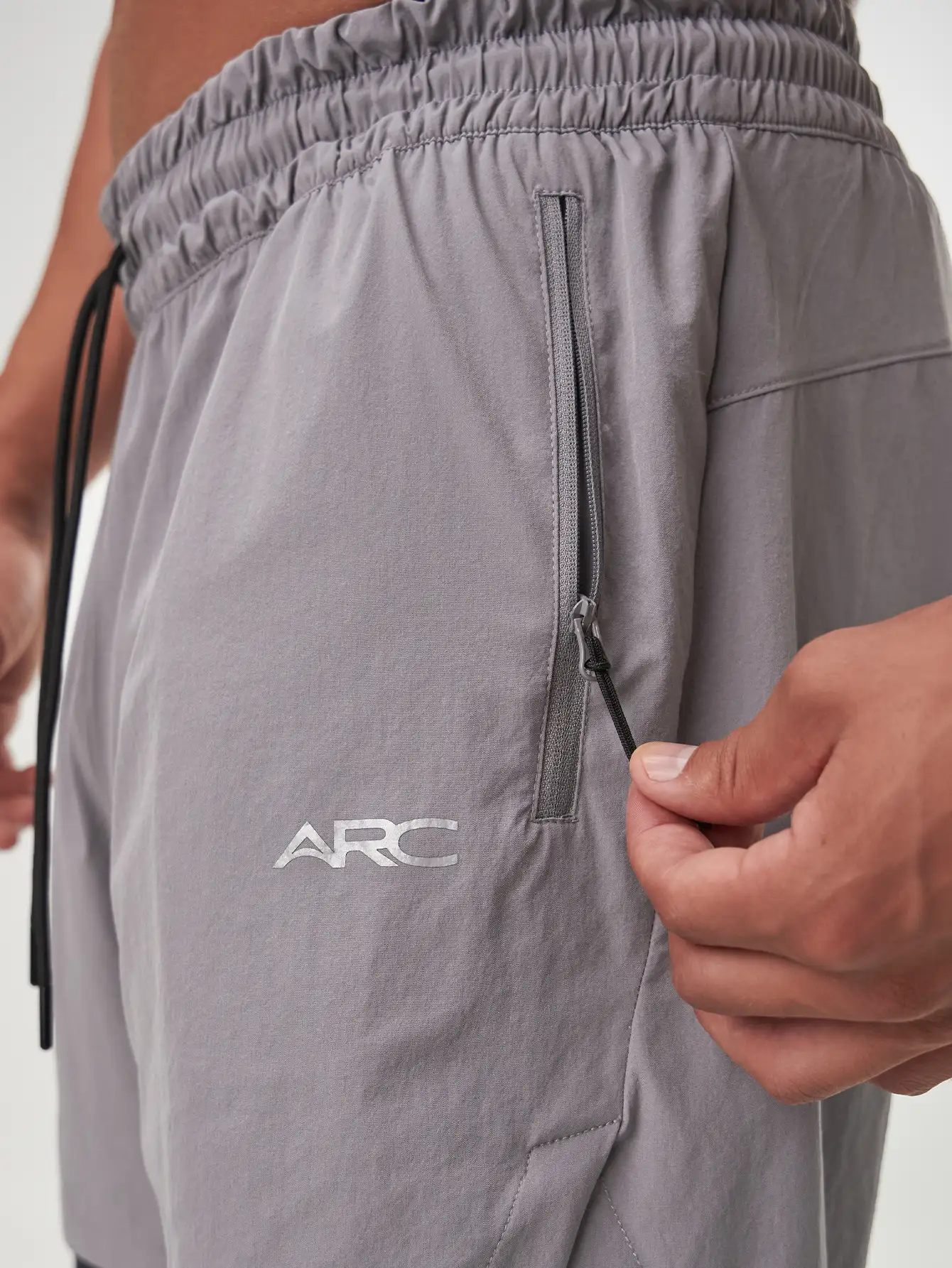 Grey Flow Form 5" 2-in-1 shorts for men, featuring lightweight fabric and moisture-wicking technology for active wear.