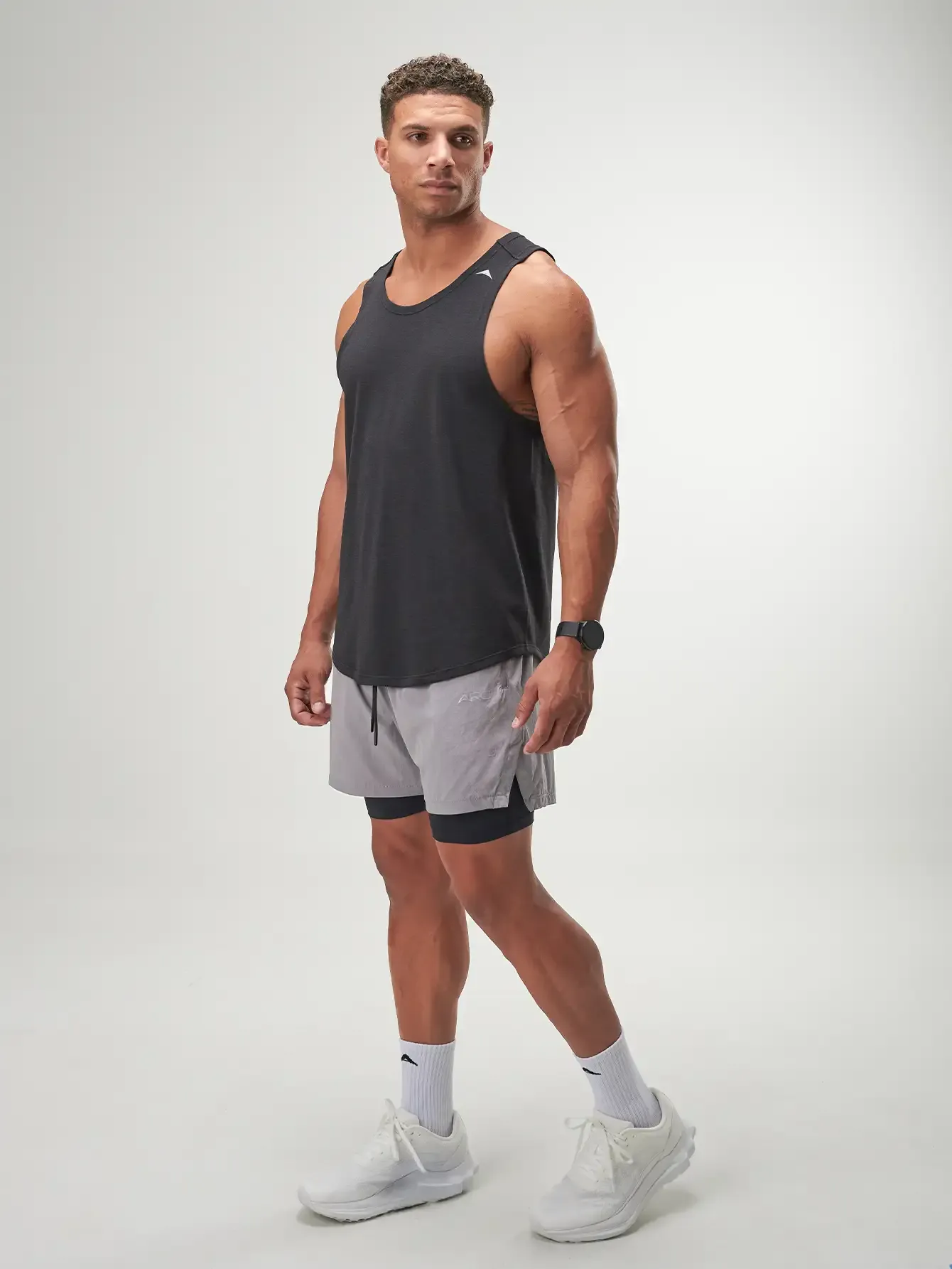 Grey Flow Form 5" 2-in-1 shorts for men, featuring moisture-wicking fabric and comfortable fit for active wear.