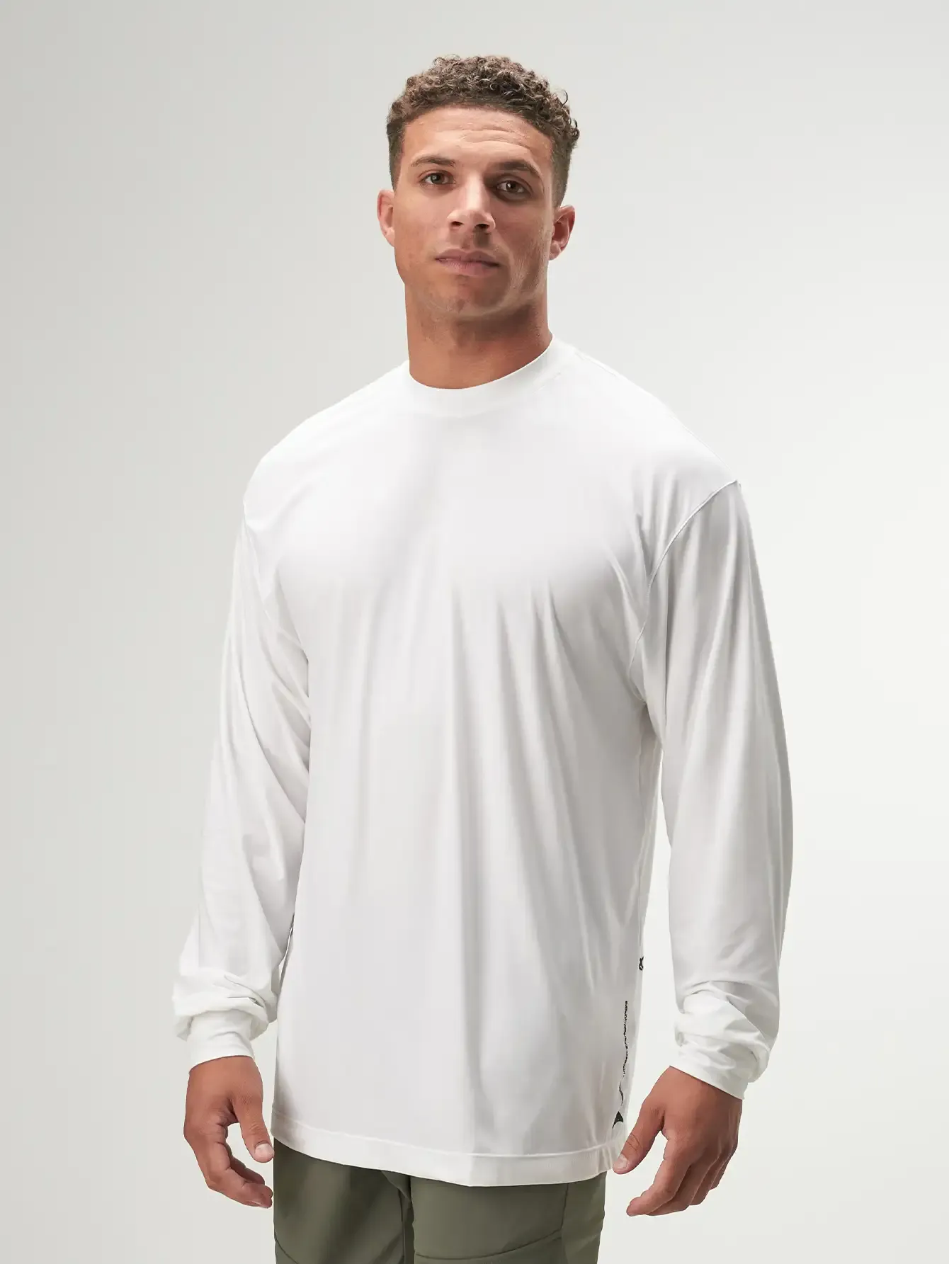 Progression Oversized White Long Sleeve Performance T-Shirt for Gym Workouts and Active Lifestyle.