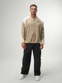 Statement Full Zip Jacket in black, featuring a modern design, lightweight fabric, and stylish zippered pockets.