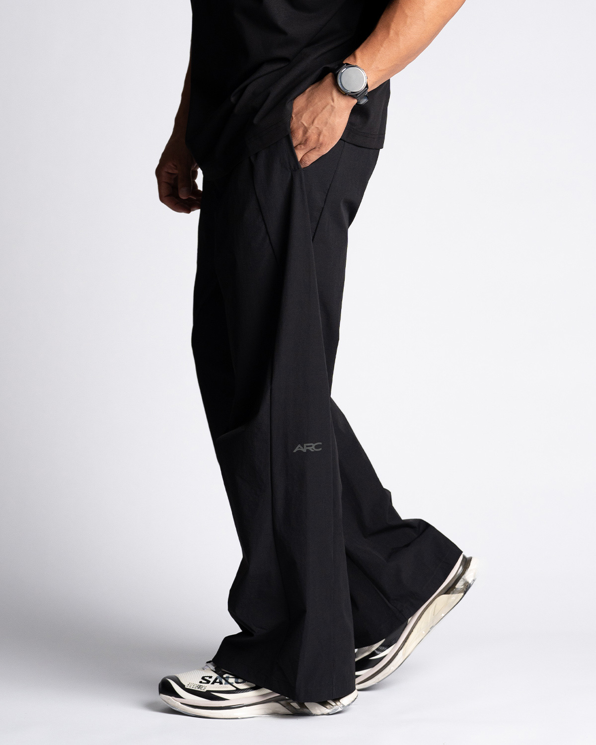 Reflect Wide Leg Pant in black, side profile, wide leg through the drop