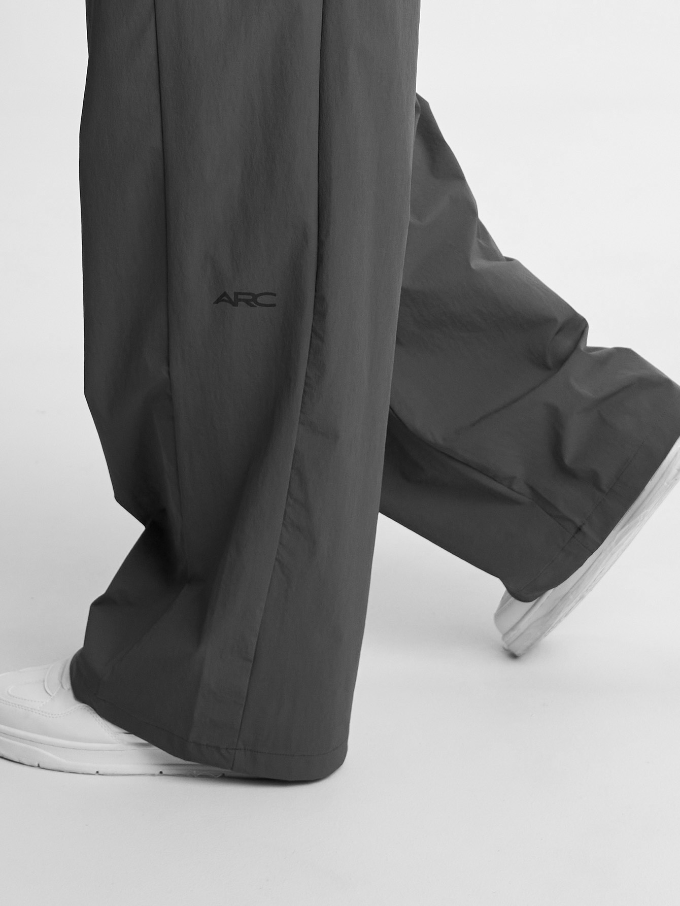 Reflect Wide Leg Pant hem detail in motion, showing the lightweight drape