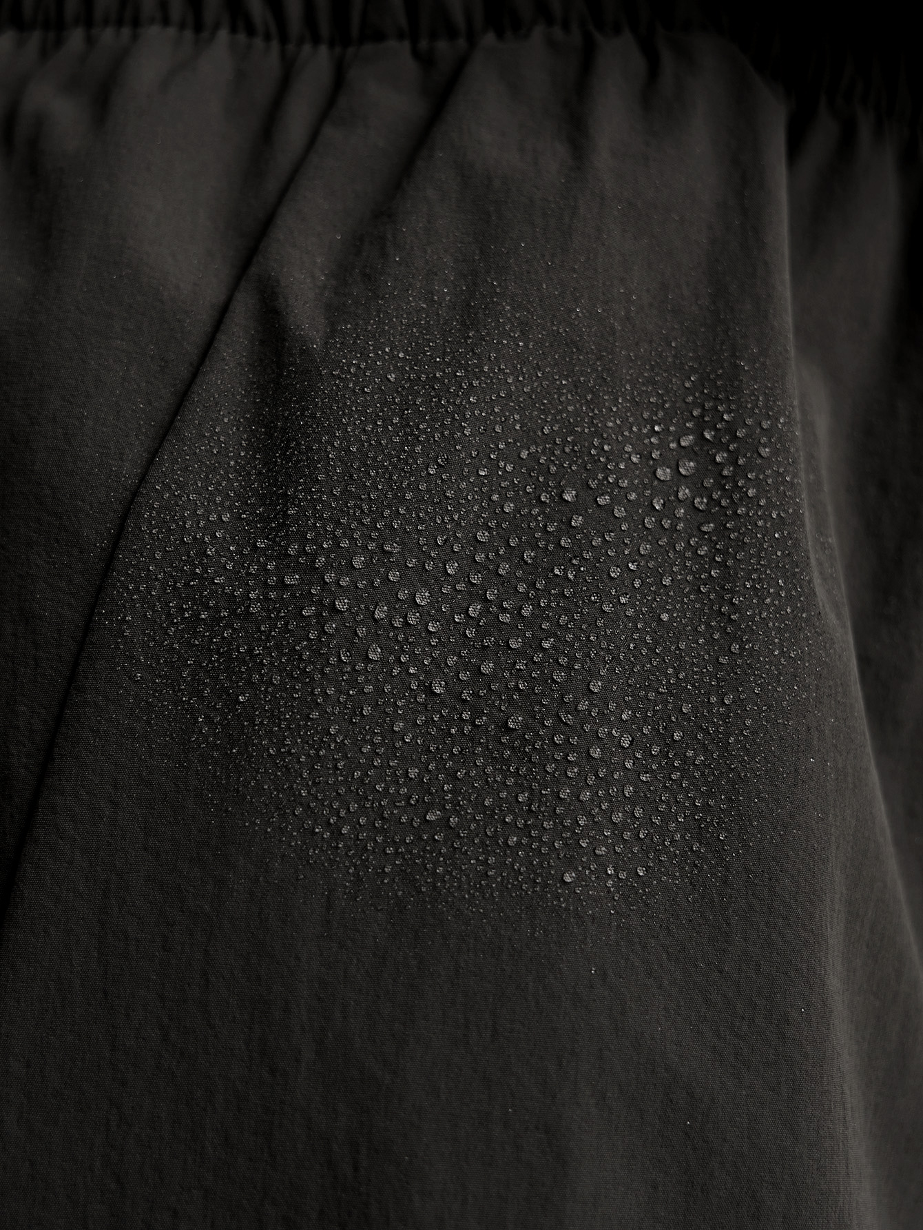 Water beading on the water-resistant fabric of the Reflect Wide Leg Pant