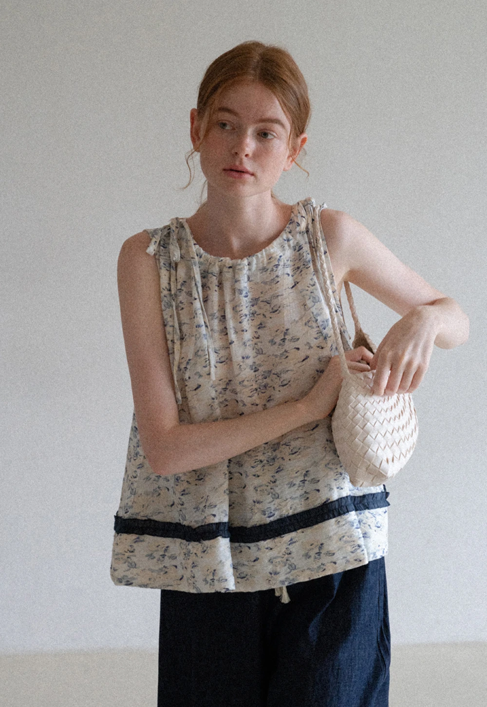 Floral Sleeveless Blouse with Ruffle Hem