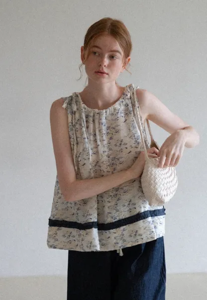 Floral Sleeveless Blouse with Ruffle Hem