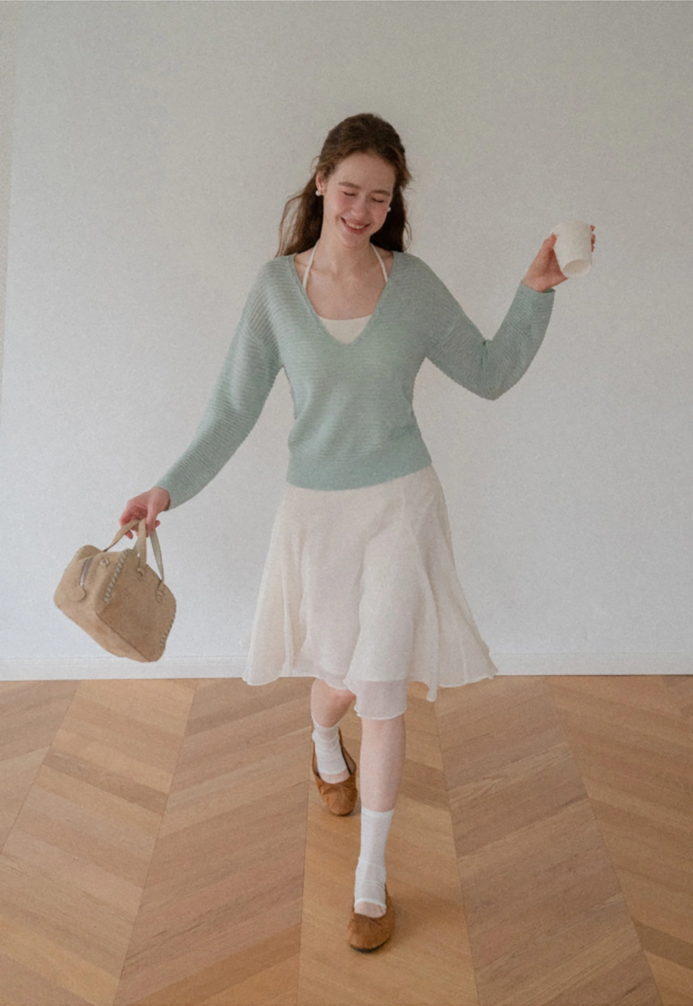 Ladies V‑Neck Knitted Pullover and White Cami Set