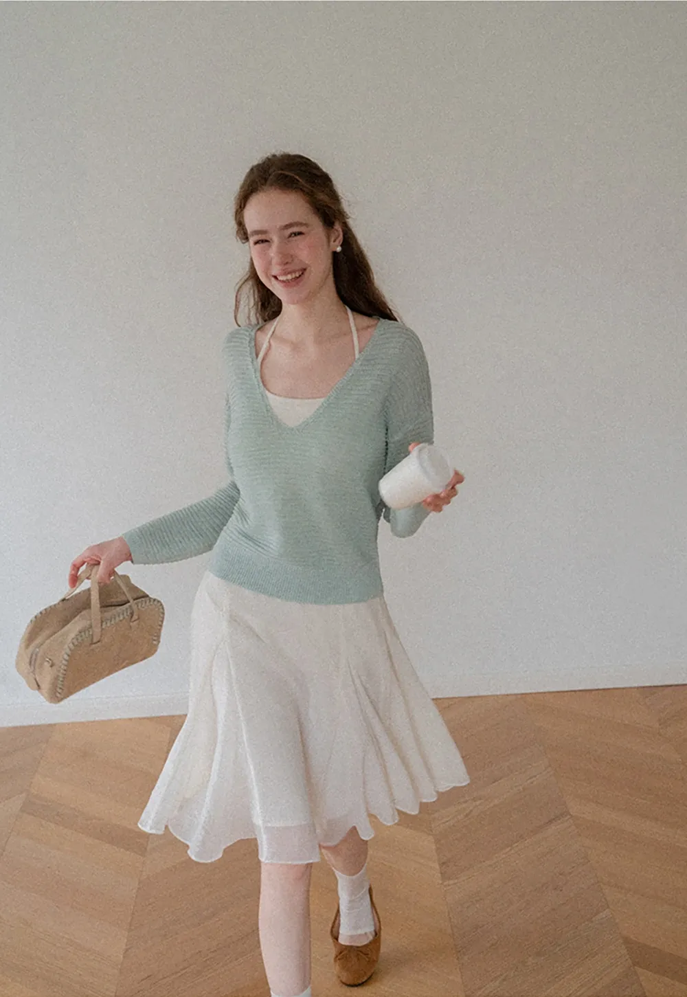 Ladies V‑Neck Knitted Pullover and White Cami Set