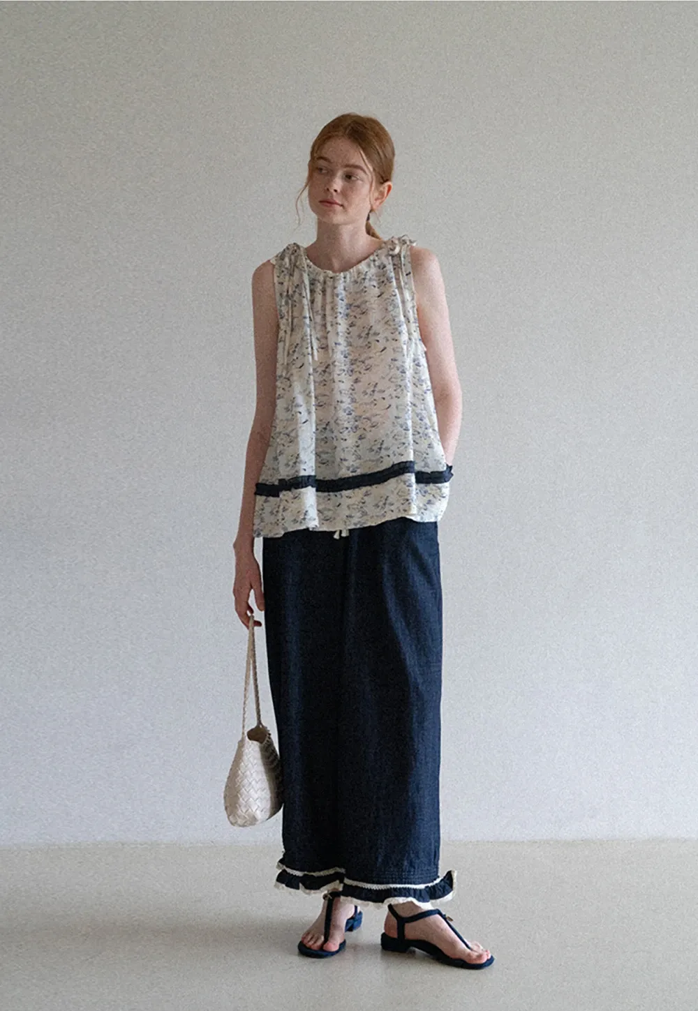 Floral Sleeveless Blouse with Ruffle Hem