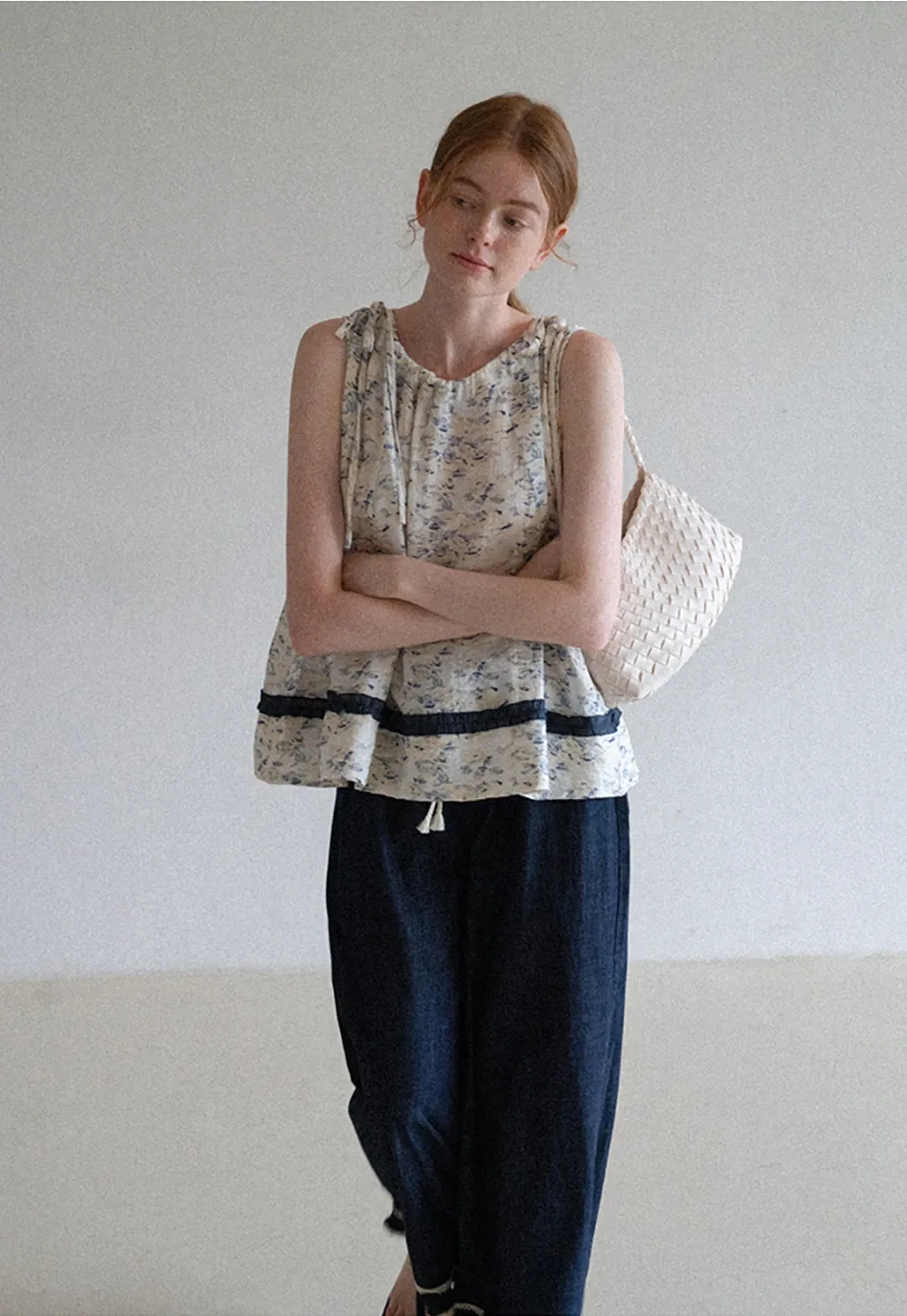 Floral Sleeveless Blouse with Ruffle Hem