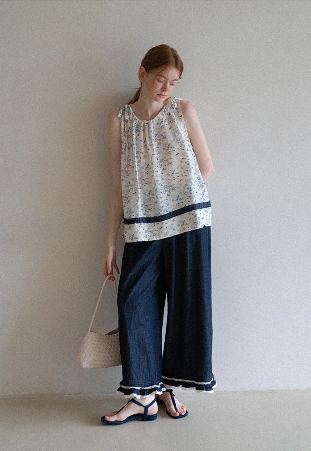 Floral Sleeveless Blouse with Ruffle Hem