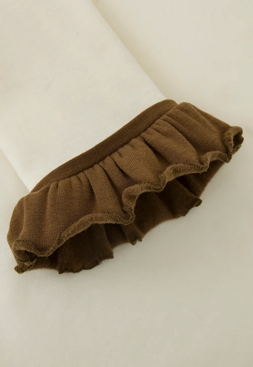 Soft Turtleneck Top with Ruffled Sleeve Cuffs